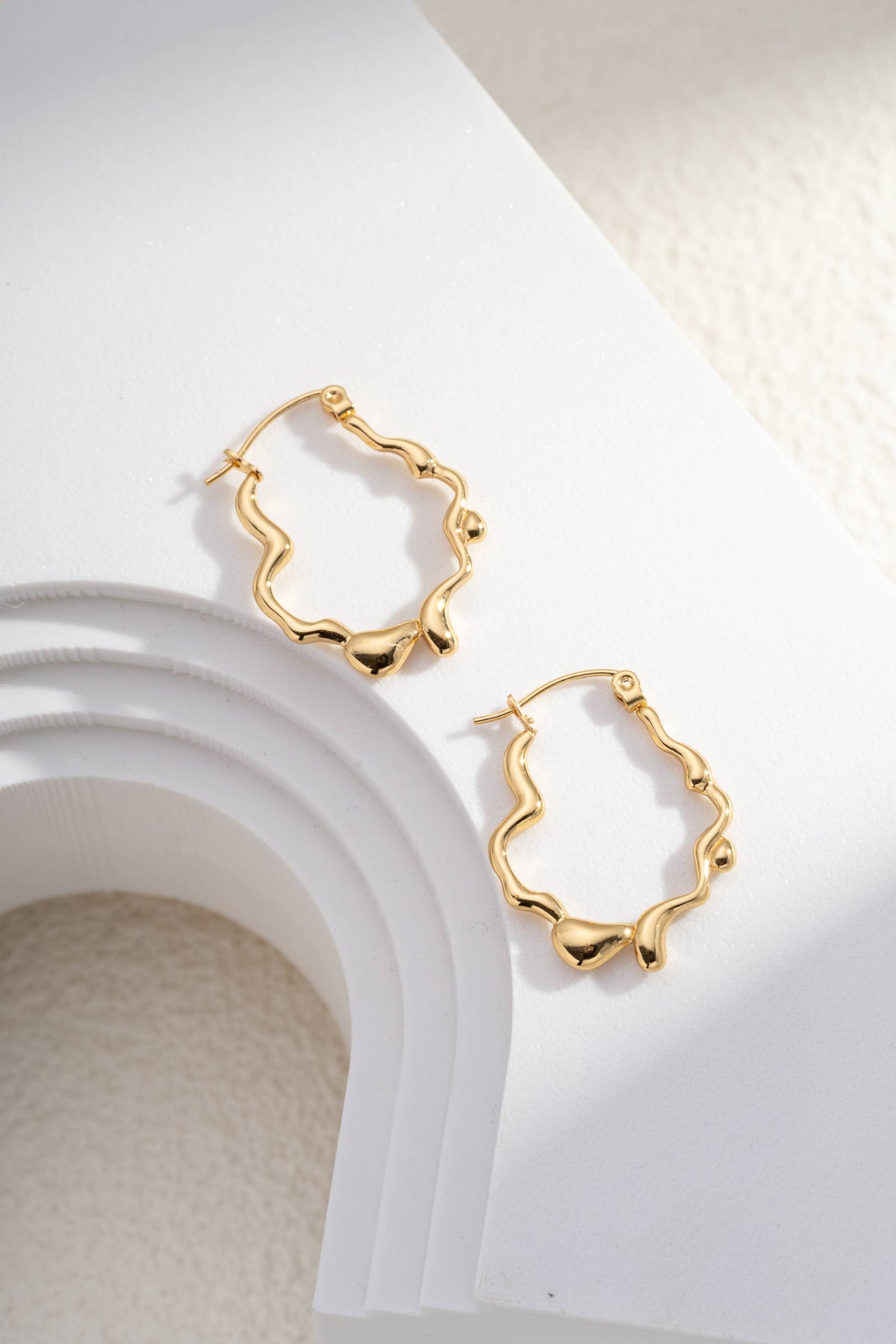 Golden Sculpted Wavy Stainless Steel Creoles Design